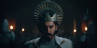 Dev Patel as The Green Knight wearing the king of Camelot crown