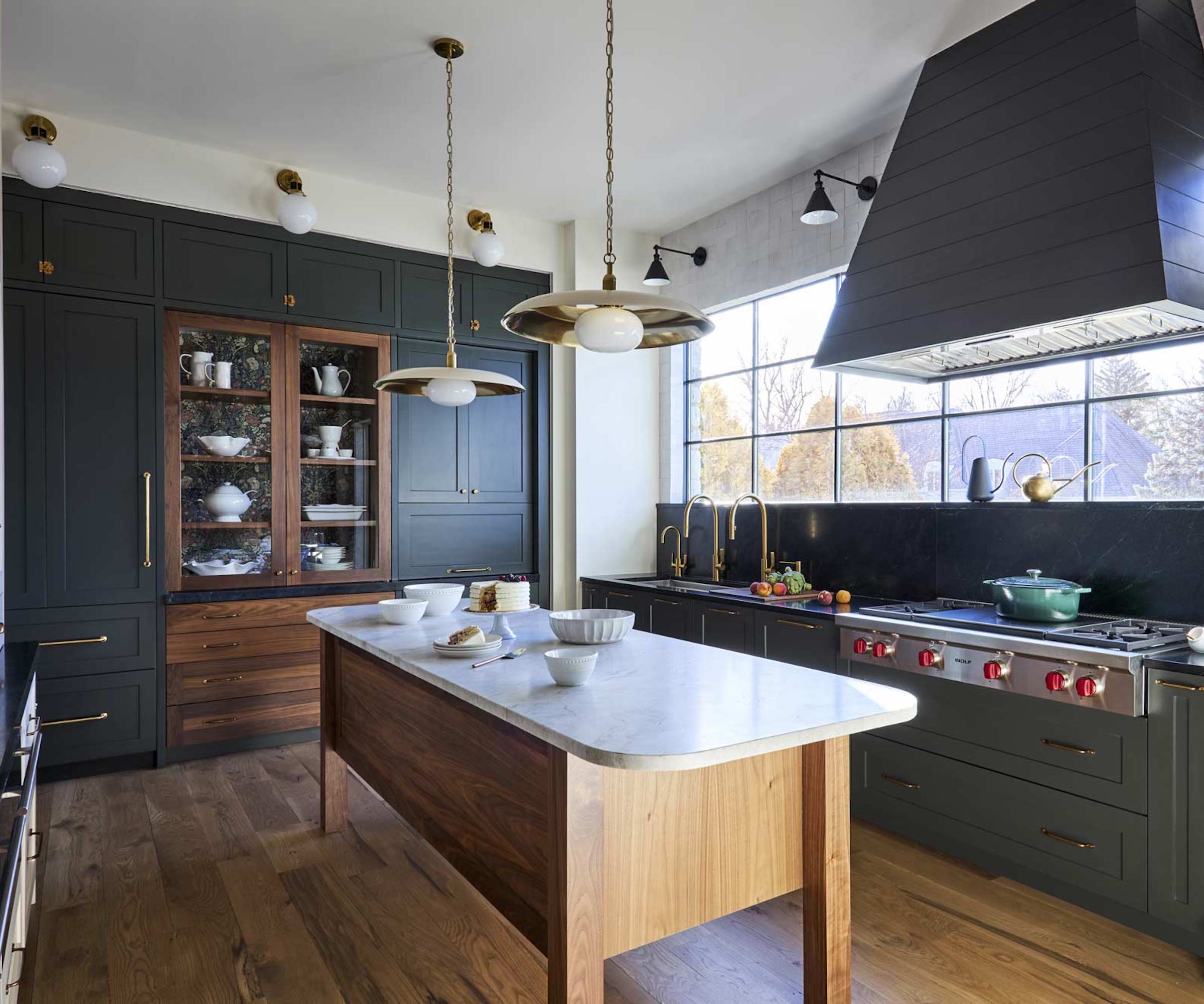 green kitchen with narrow timber island