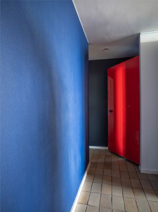 Blue wall and red door