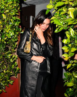 Kendall Jenner walking out of a restaurant