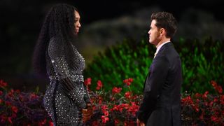 Monay and Chris standing face to face in Claim to Fame season 2