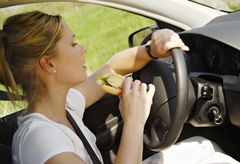 Woman eating while driving 