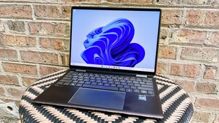 HP Spectre x360 outside on chair