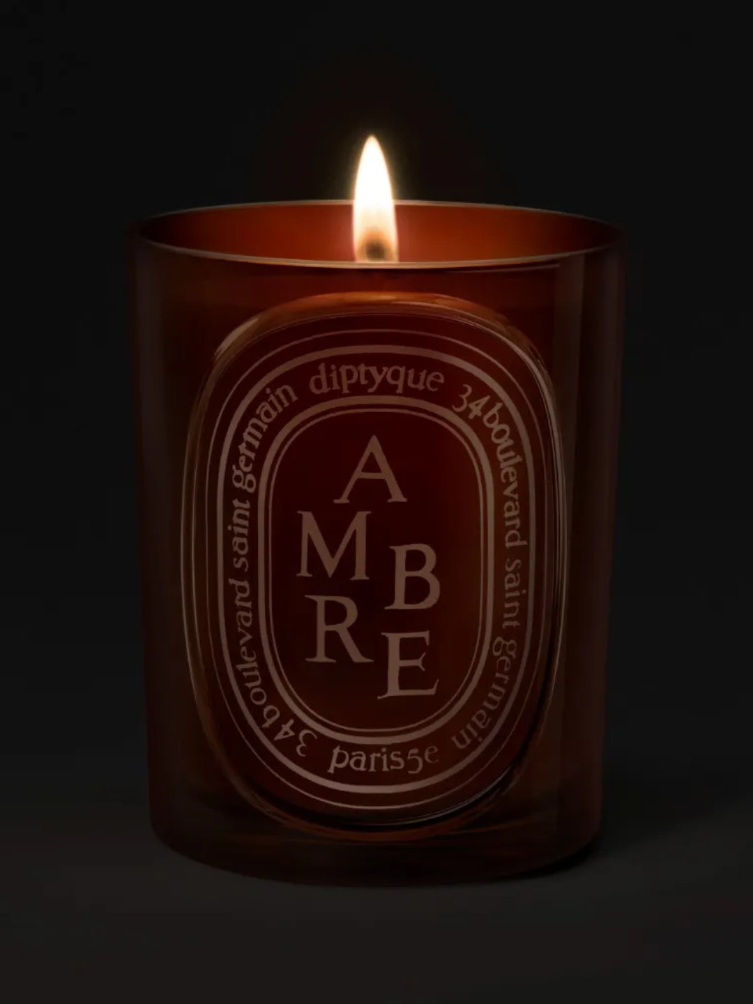An amber candle from Diptyque