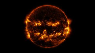 Active regions on the Sun combined to look something like a jack-o-lantern’s face on Oct. 8, 2014.