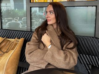 Influencer Liv Perez wearing a camel coat in Paris