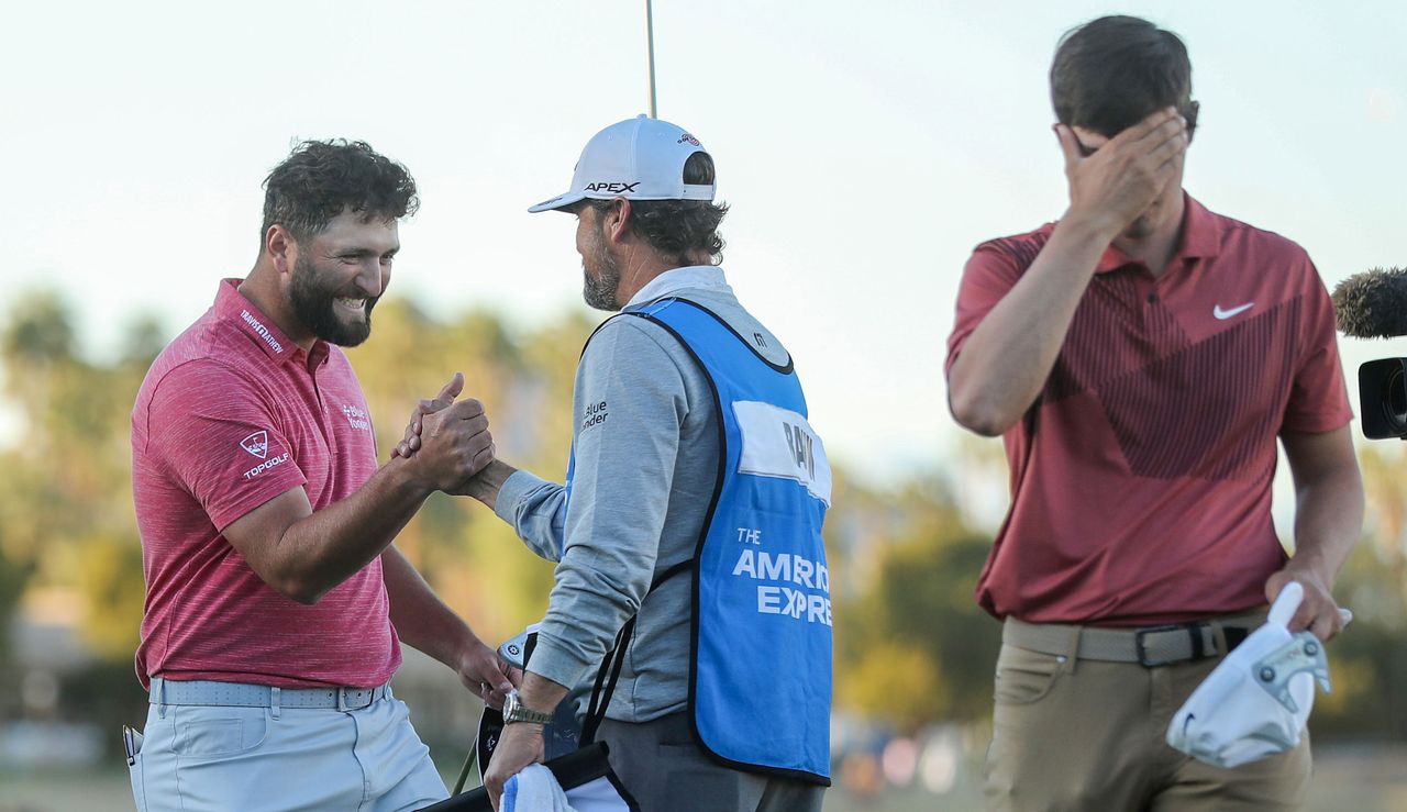 Rahm fist pumps while Thompson is distraught 