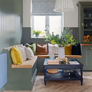 green kitchen with wood panelling