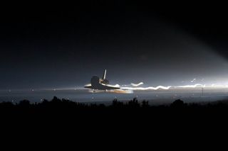 Space shuttle Atlantis (STS-135) touches down at NASA's Kennedy Space Center Shuttle Landing Facility (SLF), completing its 13-day mission to the International Space Station (ISS) and the final flight of the Space Shuttle Program, early Thursday morning, July 21, 2011, in Cape Canaveral, Fla.