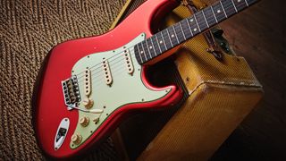 A Fender Stratocaster with a red finish