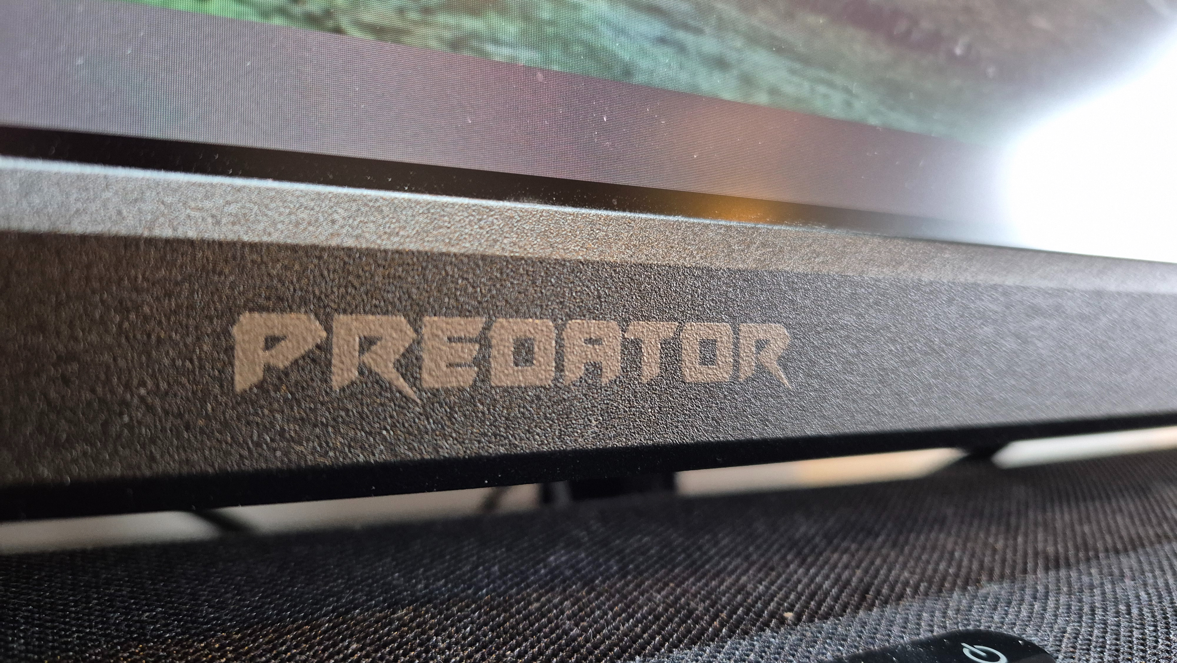 The logo of the Acer Predator X32QFS gaming monitor.