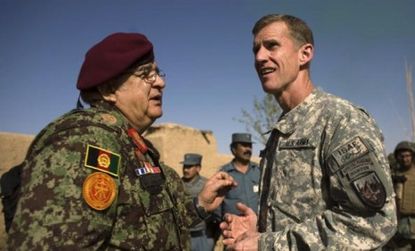 Stanley McCrystal talks with Afghan defense minster Abdul Rahim Wardak.