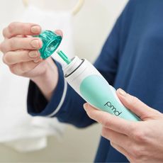 woman using the PMD Microderm skincare tool