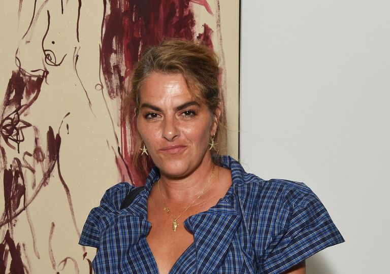 Tracey Emin in front of her art work