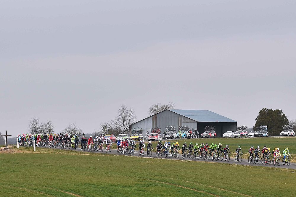 The peloton rolls through the countryside.