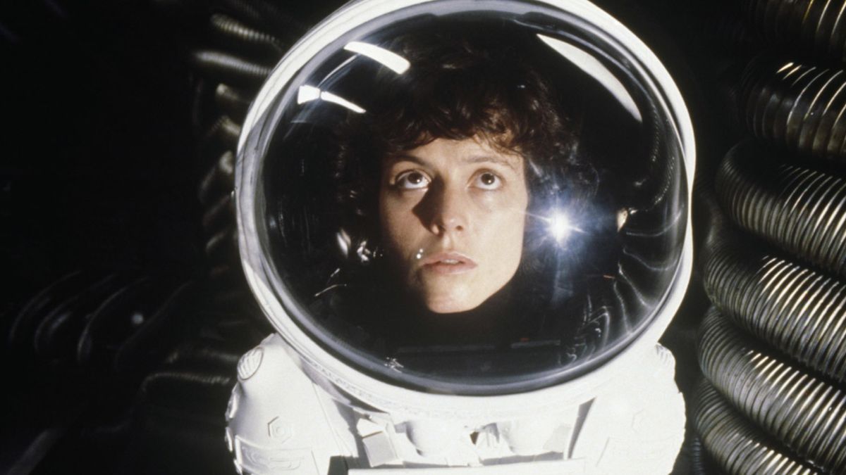 Sigourney Weaver as Ripley wearing a spacesuit in the movie Alien.