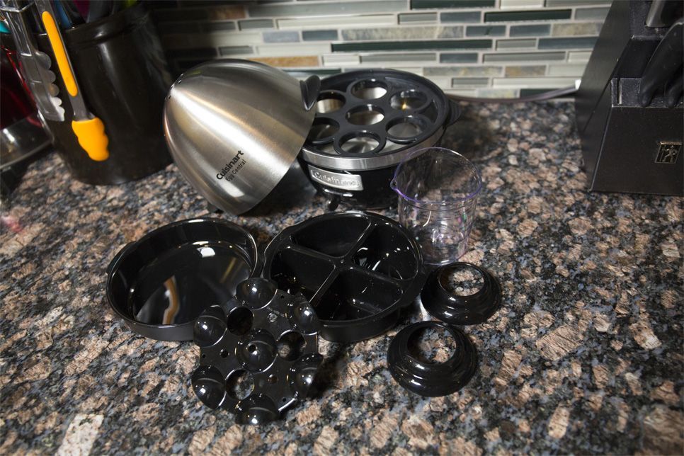 This Cuisinart egg cooker comes with an omelet tray, a poaching tray that holds four eggs, and two small egg stands that hold your egg upright if you enjoy eating soft-cooked eggs in the shell.