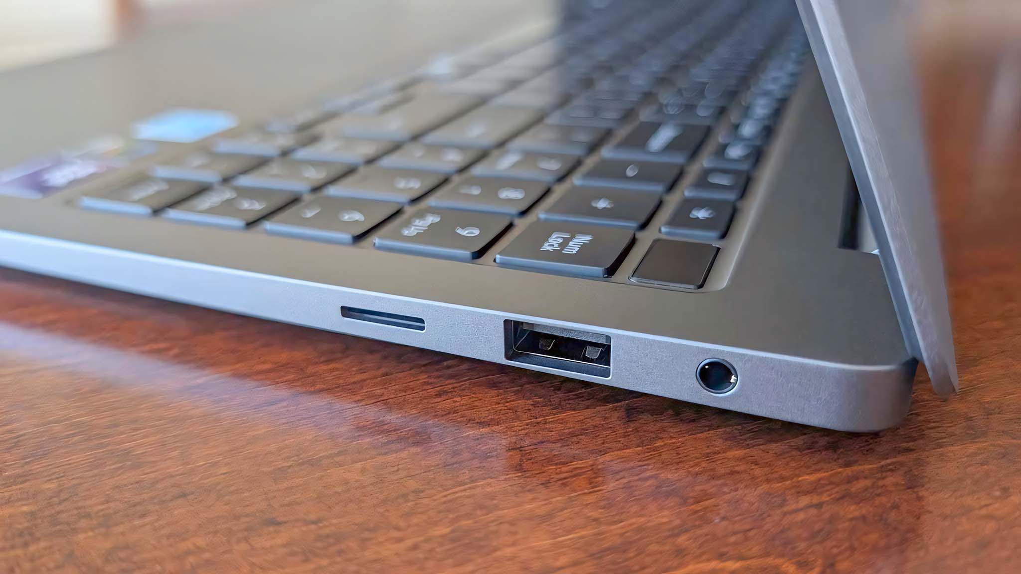 A closeup shot of the microSD card reader, USB-A port, and headphone jack on Samsung Galaxy Book5 Pro's left side.