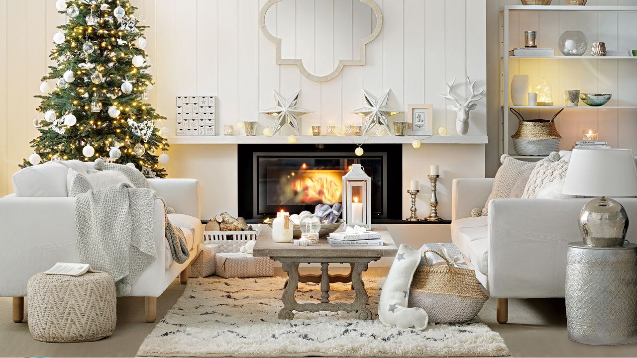 White living room dressed for Christmas with a Christmas tree