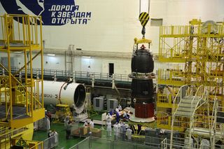 The Russian Progress 48 supply ship is prepared for its Aug. 1, 2012 launch. The spacecraft will launch and dock with the International Space Station in an unprecedented test flight.