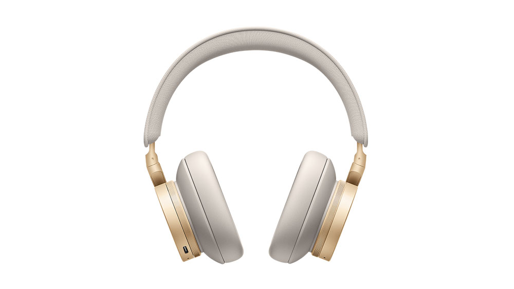 The B&O Beoplay h95 headphones in gold on a white background.