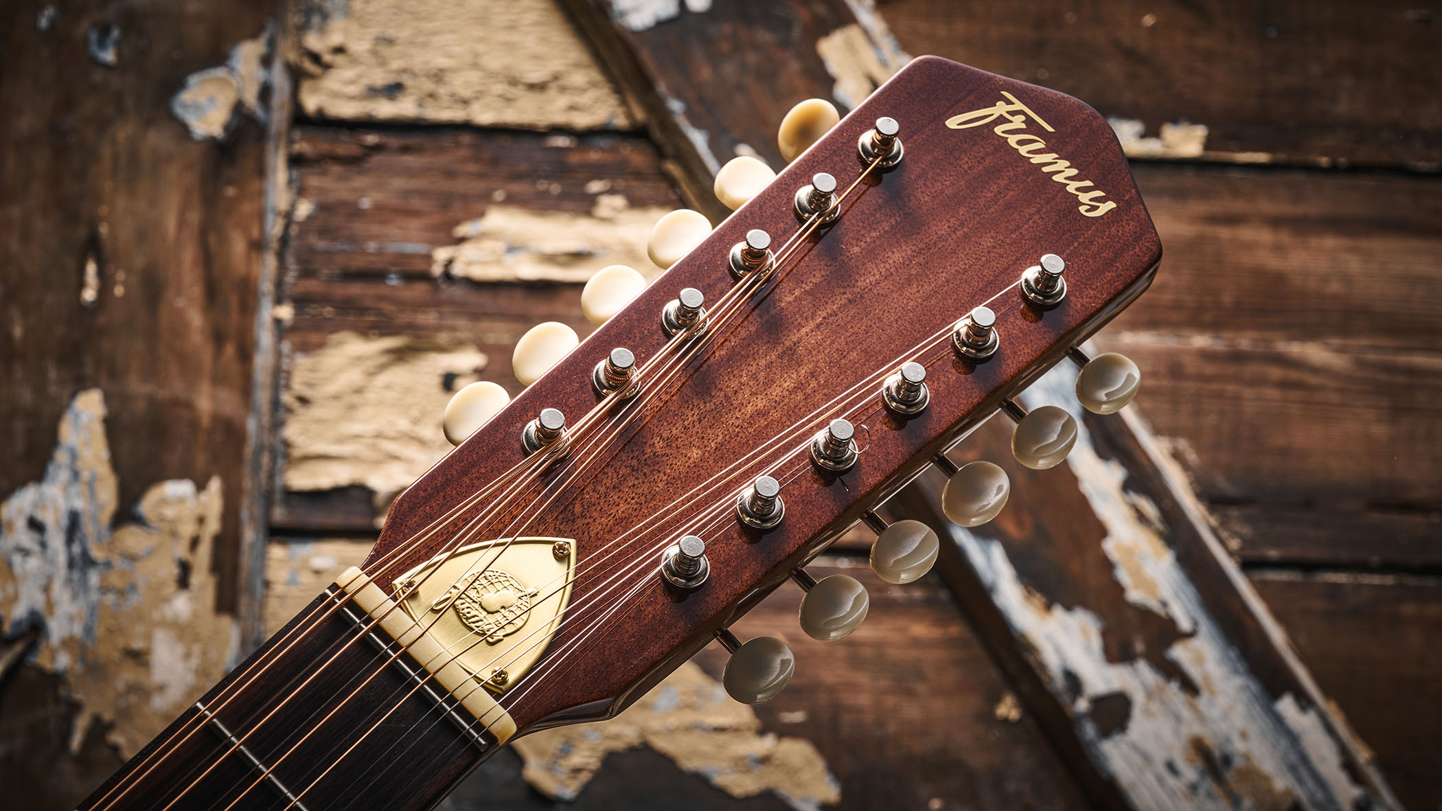 Framus&#039;s replica of original 12-string that John Lennon used on the Beatles&#039; Help! and Rubber Soul, photographed in close-up against a distressed wooden floor.