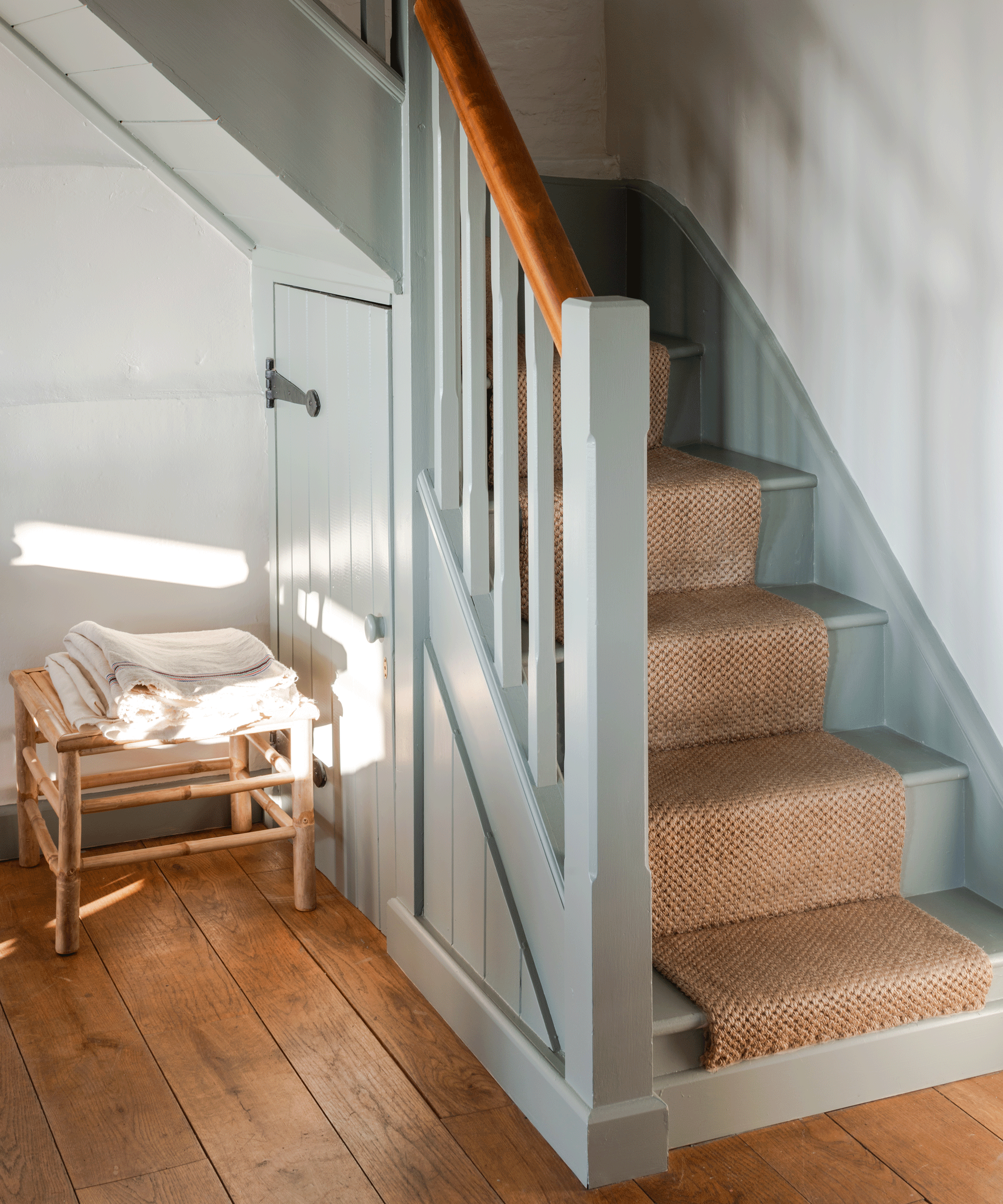 Wooden staircase painted in blue grey