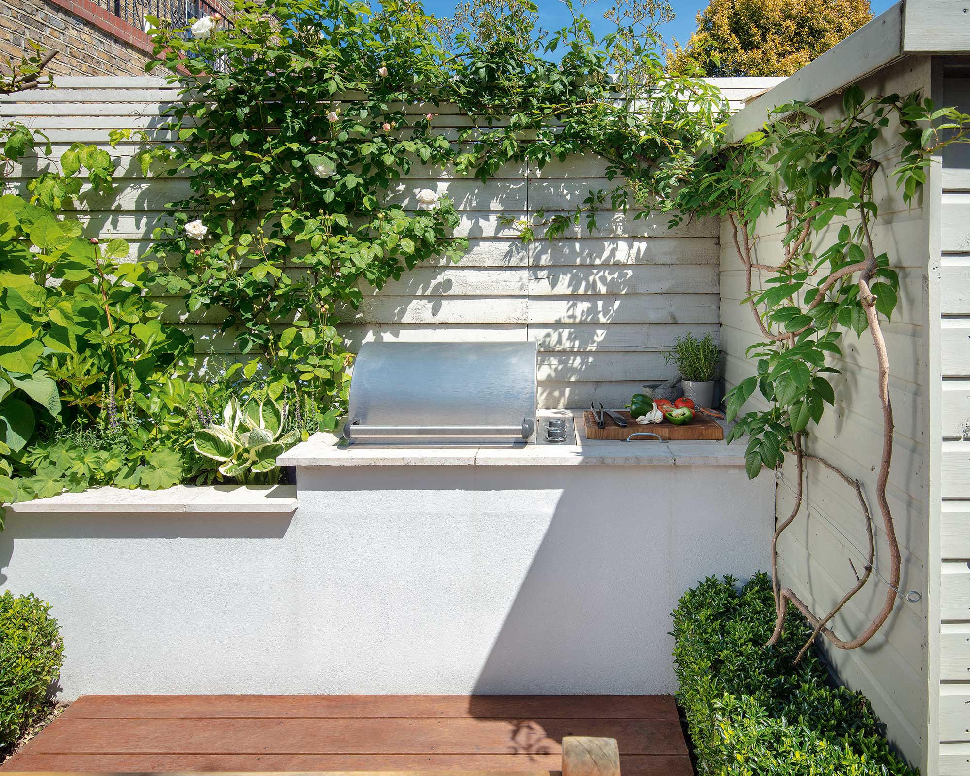 outdoor grill station with plants