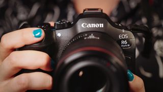 Canon EOS R6 Mark III being held by a photographer