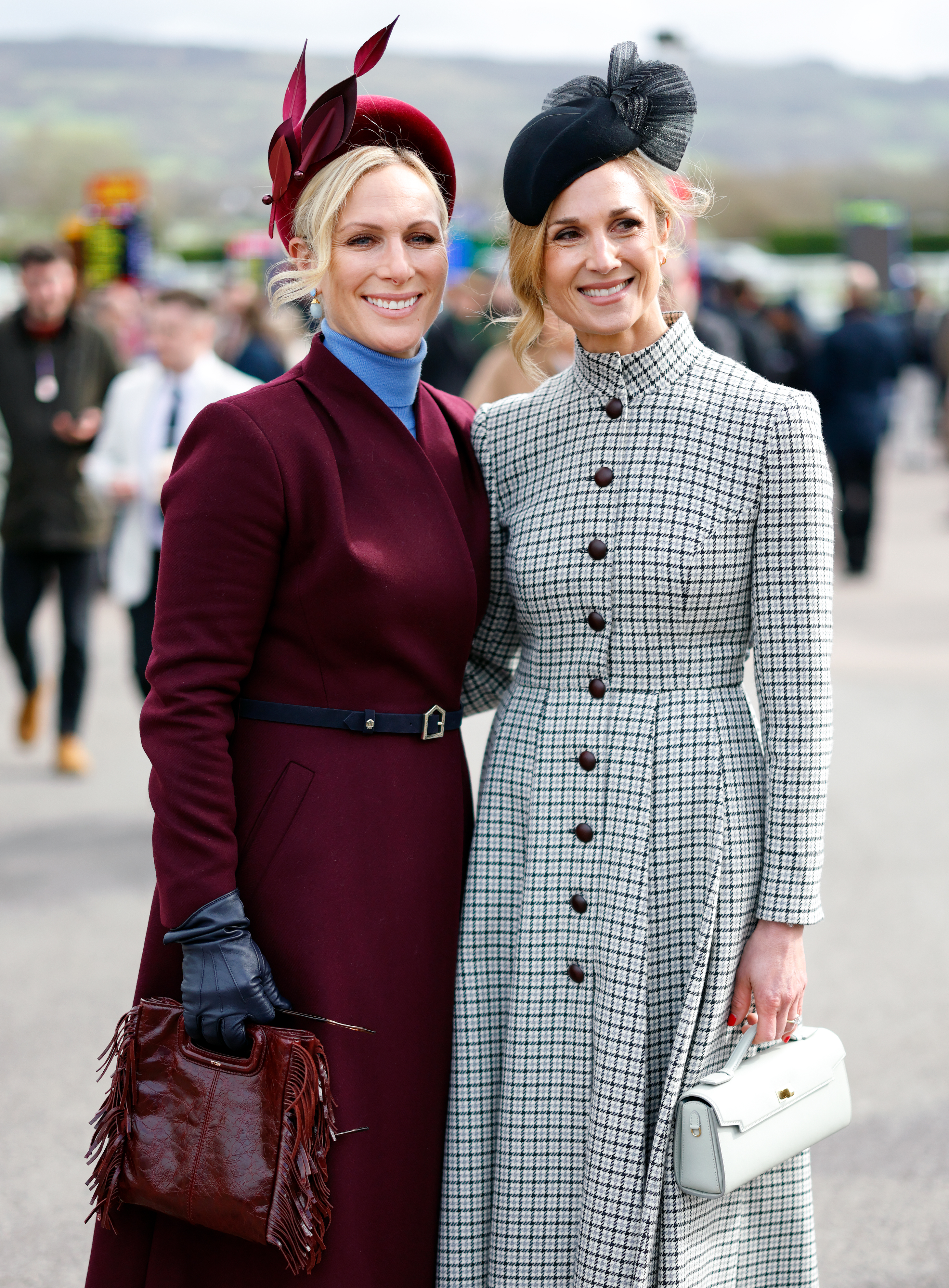Zara Tindall and Harriet Sperling dressed in long coats and smiling