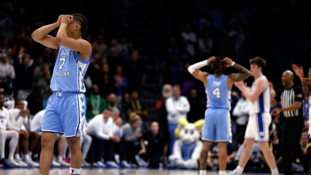 Seth Trimble holds his head during the defeat of North Carolina against Duke at the ACC tournament in his hands