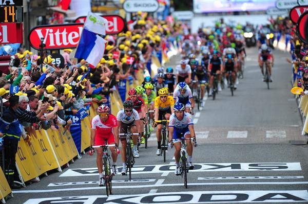 The yellow jersey group cross the line on stage 14 - some 18 minutes after the winner