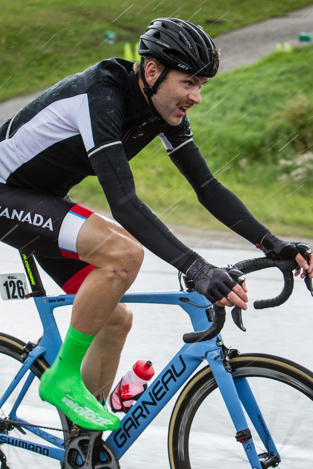 Alexis Cartier (Canada) braves the rain while riding in the break