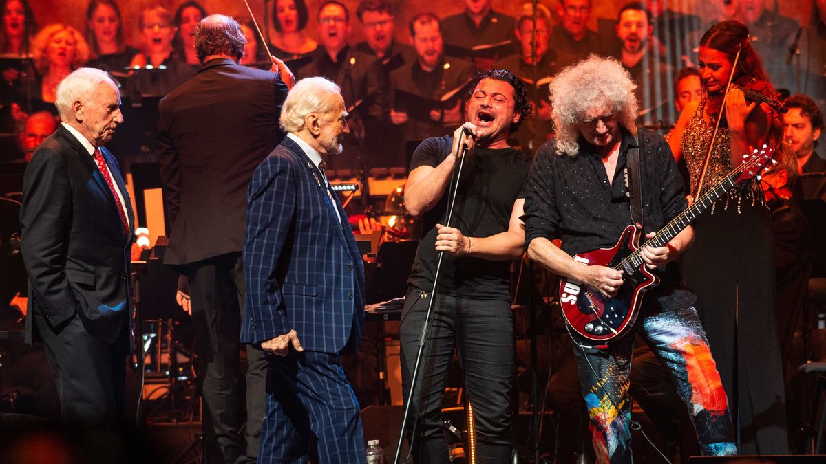 Brian May onstage with Buzz Aldrin