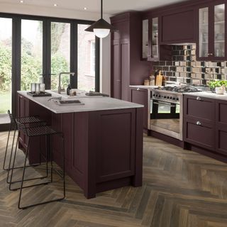 Purple kitchen with island and parquet floor tiles