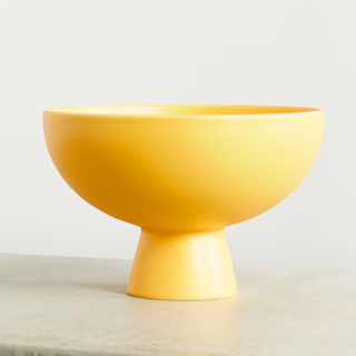 Yellow stone pedestal bowl
