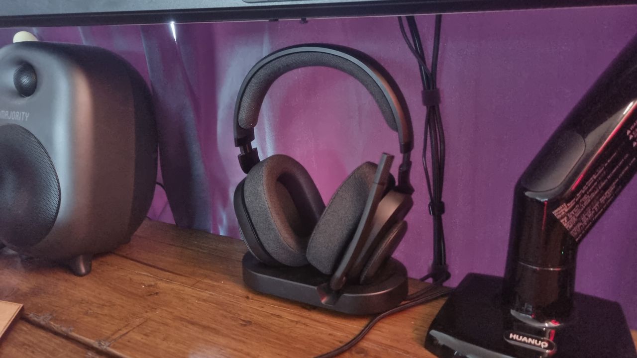The Fractal Scape gaming headset atop its stand, on a desk