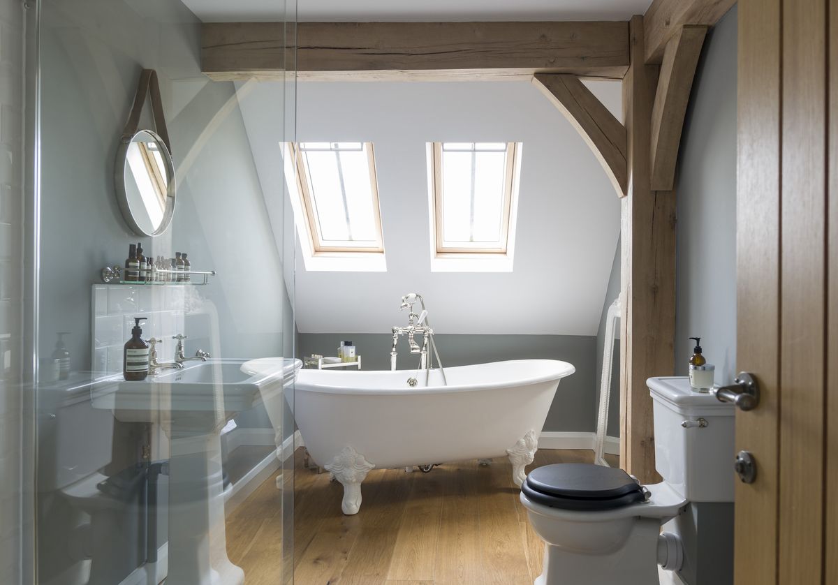 freestanding bath in oak framed bathroom