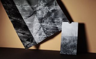 Invitation with greyscale photographic image printed on UV varnished embossed paper