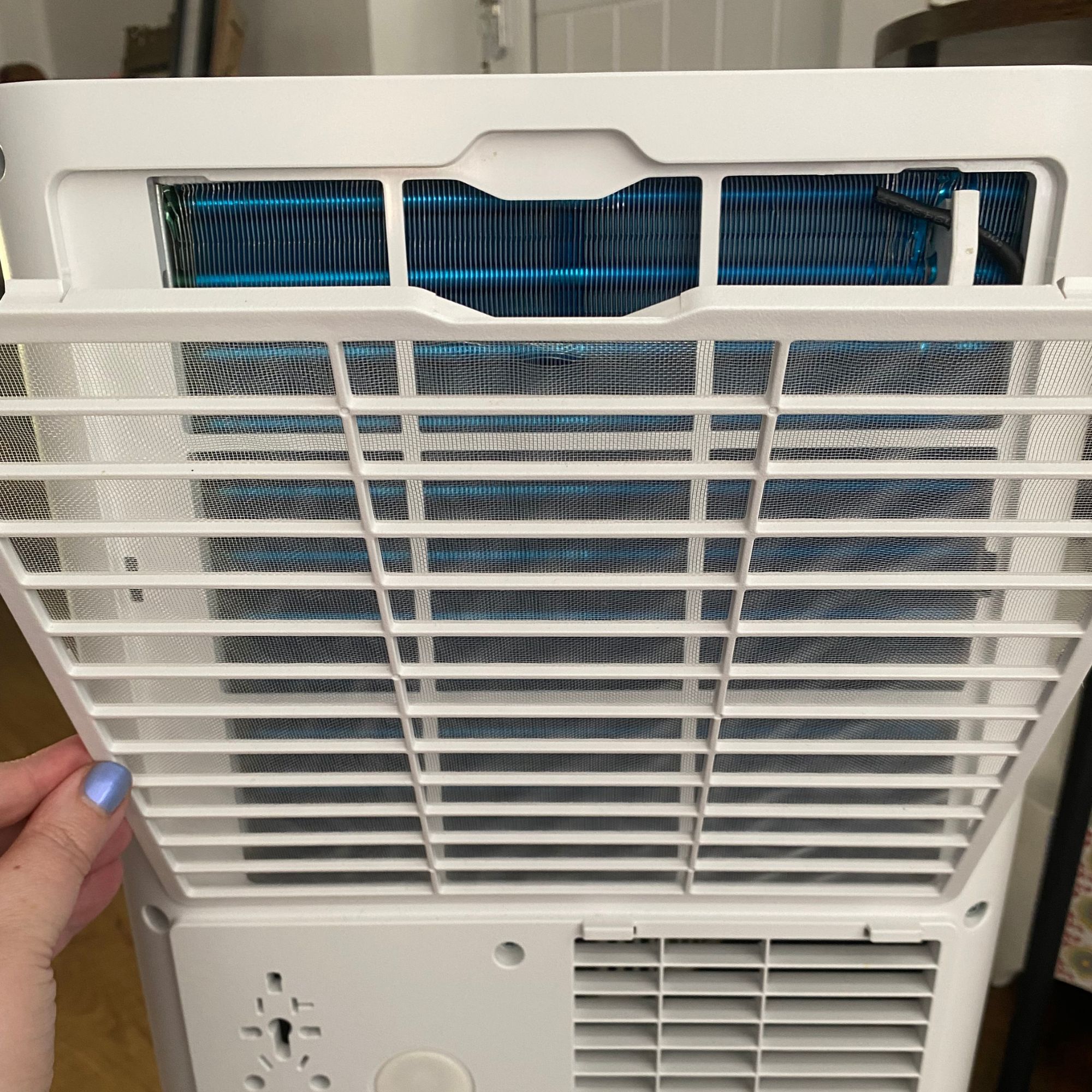 Removing the air filter on the back of the Devola DVAC09CW portable air conditioner