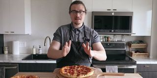 Joshua Weissman on his YouTube channel making pizza.