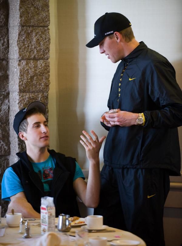 Axel Merckx takes Taylor Phinney's iPhone away at the breakfast table.