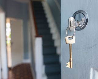 key in the lock of a front door