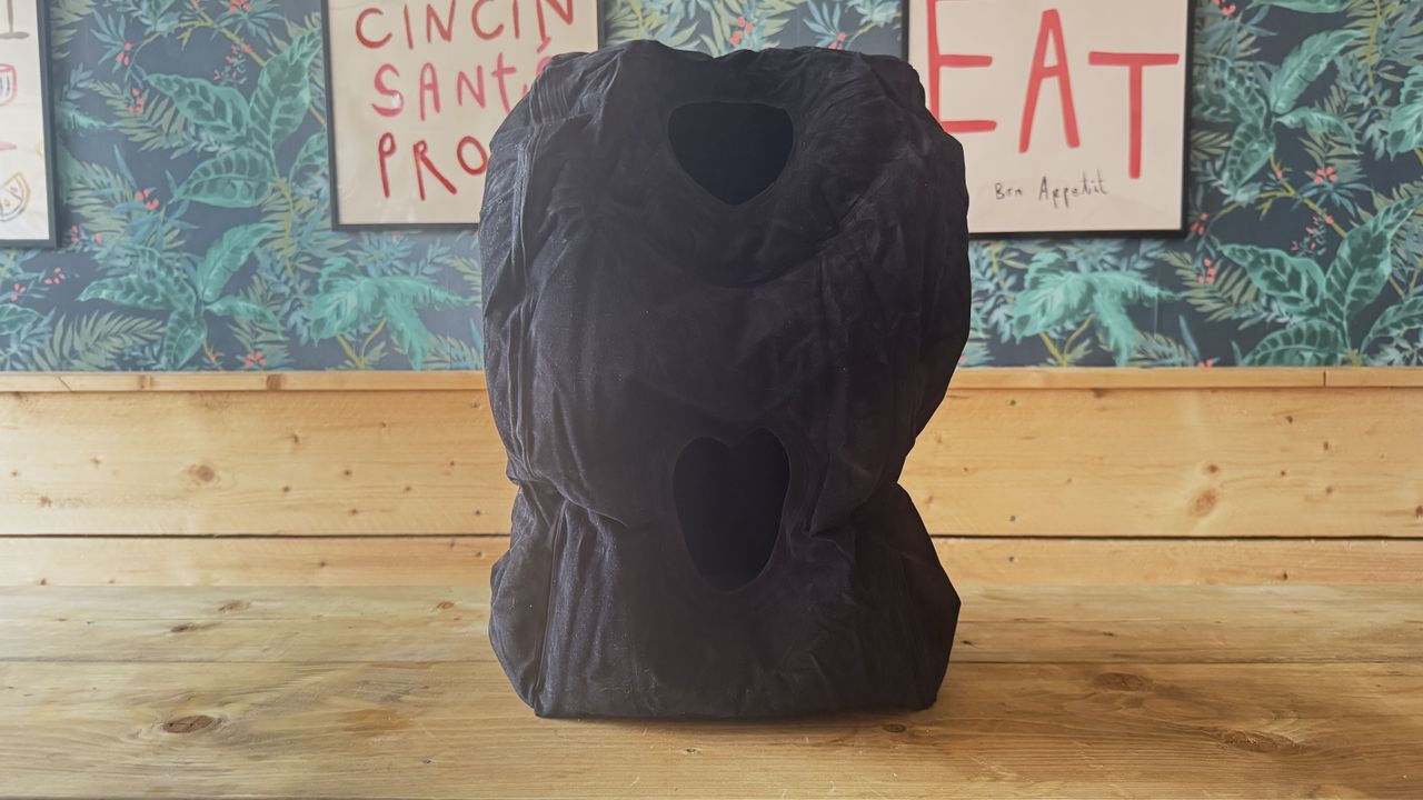The Maliton inflatable travel pillow packaged and inflated
