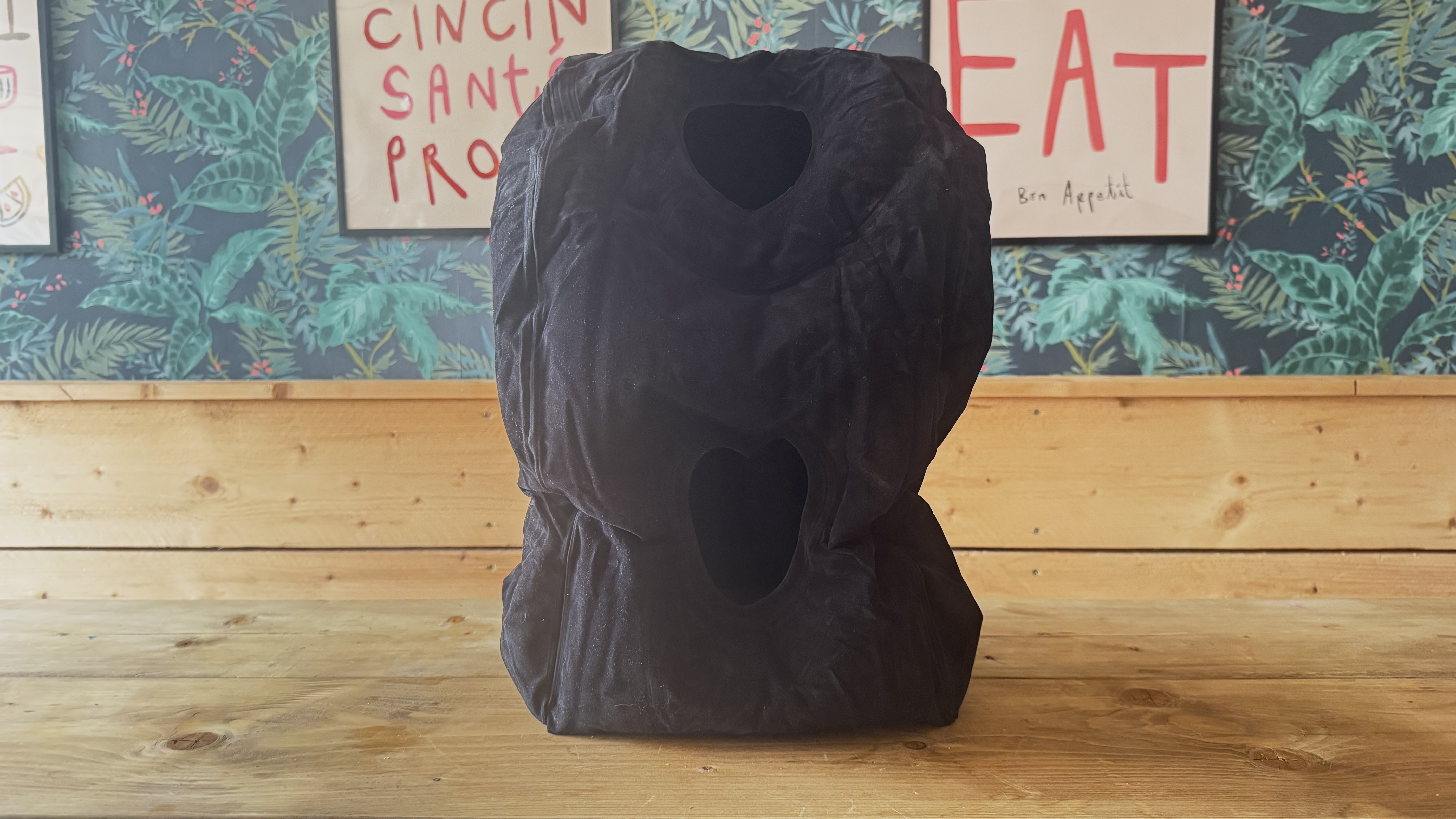 The Maliton inflatable travel pillow packaged and inflated
