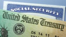 United States Treasury government check rests on top of a Social Security card.