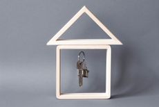  model of a wooden house and the keys 