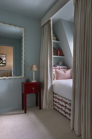 A bedroom with warm aqua hue