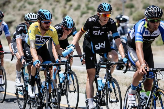 Bradley Wiggins (Sky) taking on bottles for the climb