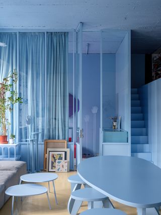 Light blue curtains in a monchromatic room